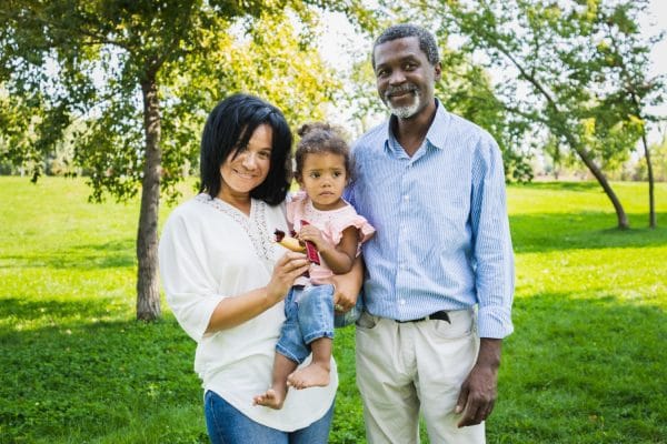 beautiful happy african american family bonding at the park black family having fun outdoors