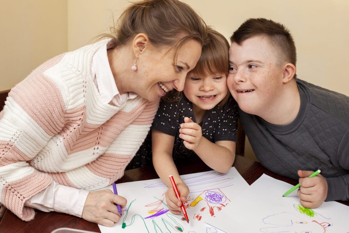 happy woman with children with down syndrome